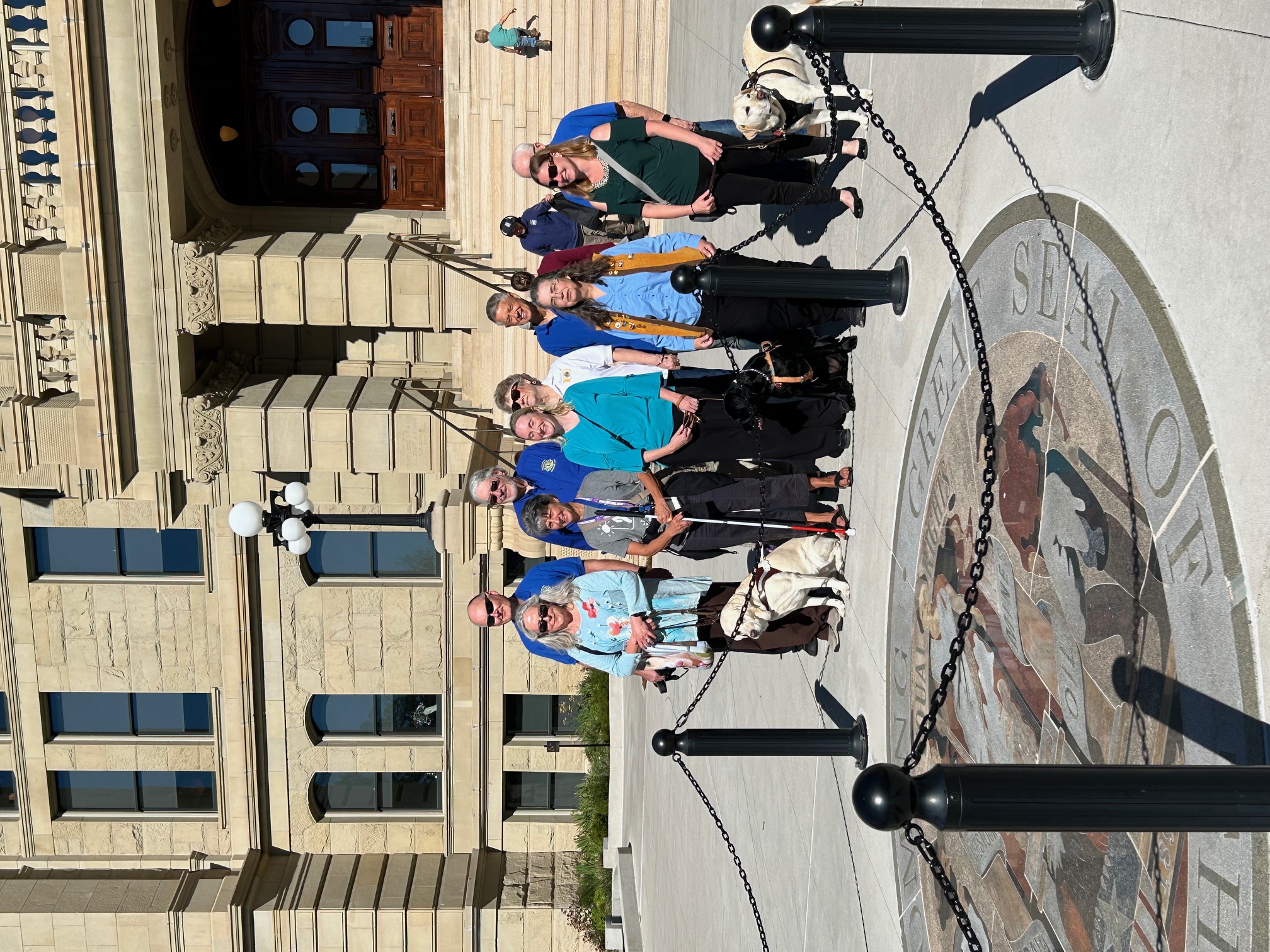 group in front of State Seal of Wyoming